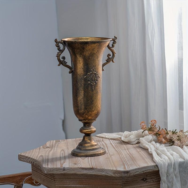 Vintage metal vase with distressed finish for elegant home accents.