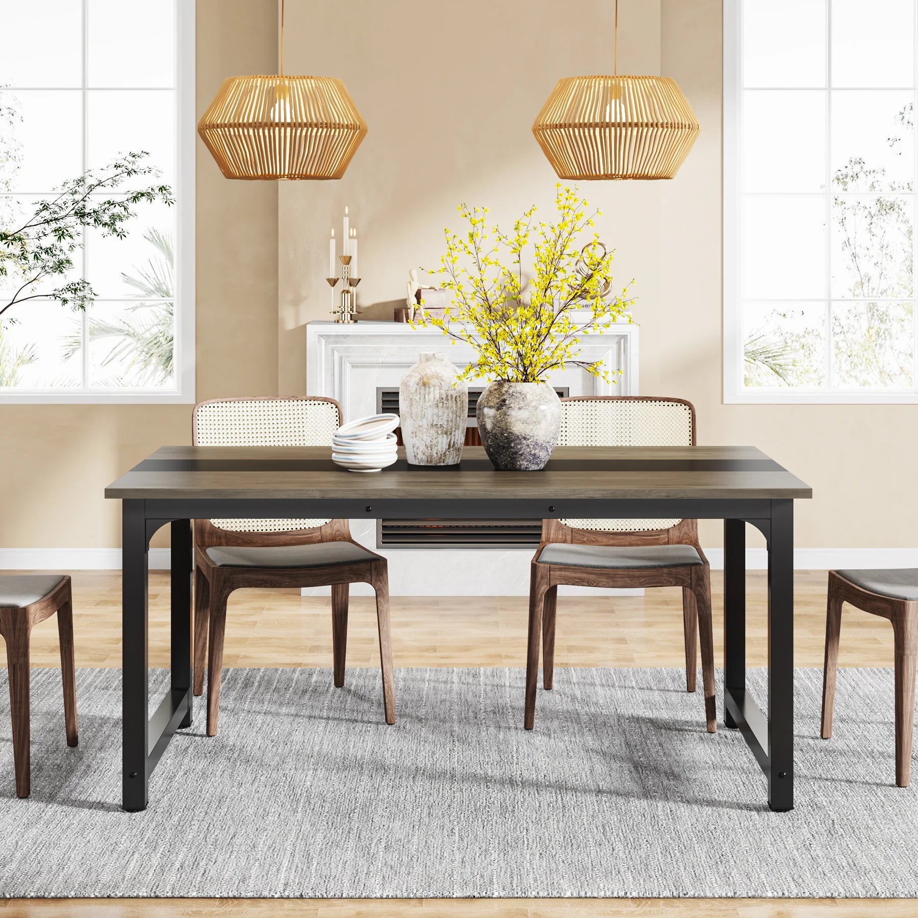 Dining room with a black table and wooden chairs, featuring a fireplace and decorative elements.