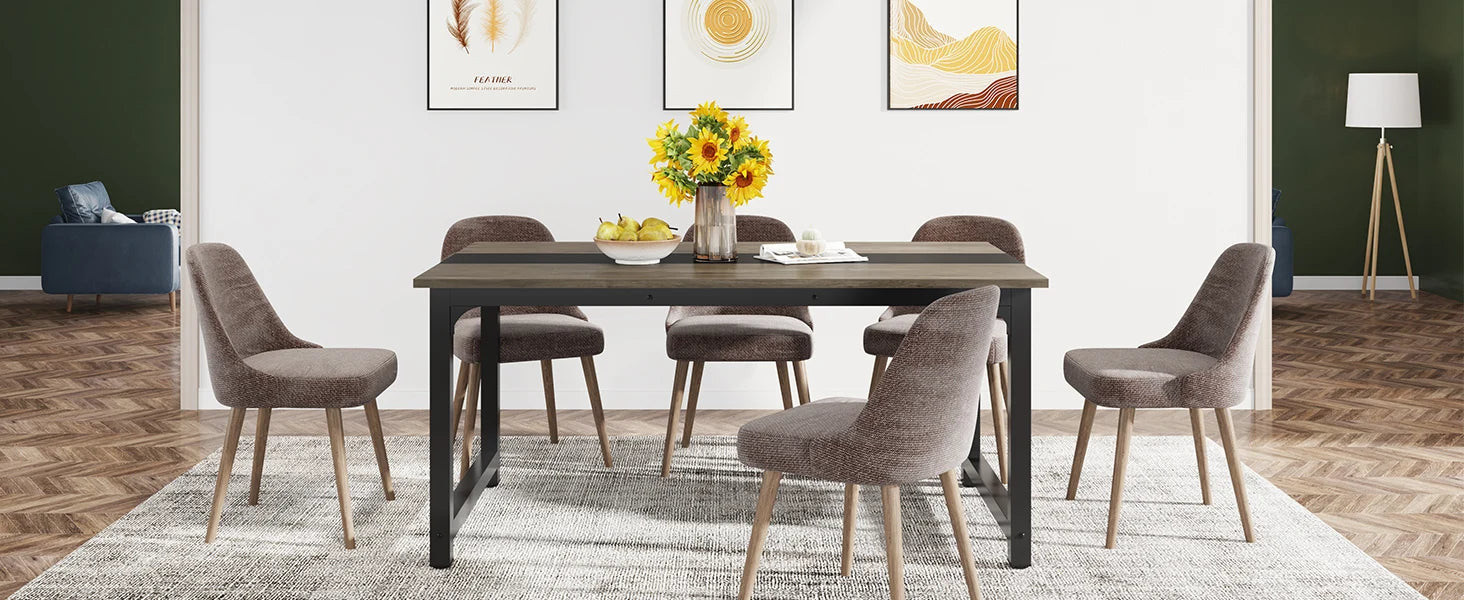 Dining room with a table and chairs in a well-lit room.