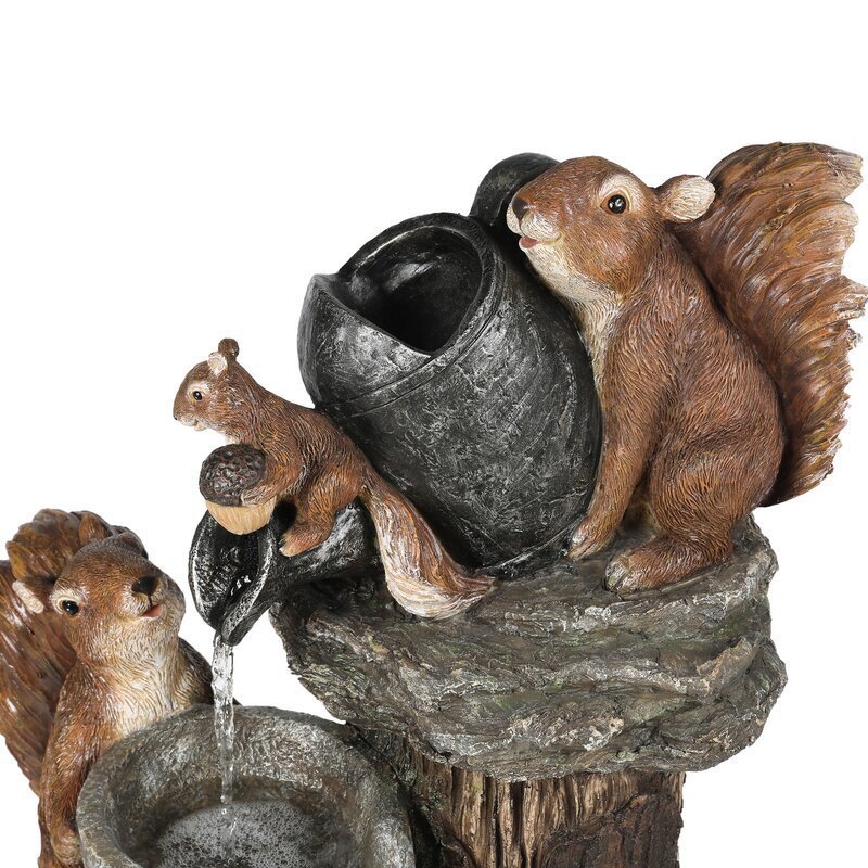 Decorative fountain with squirrel figures on a white background