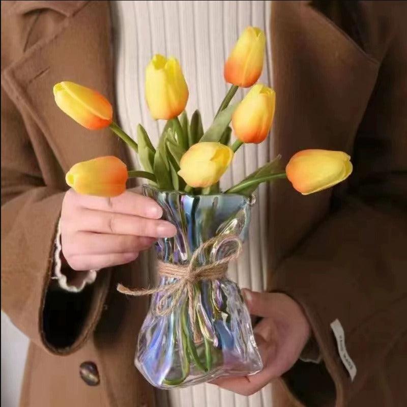 Transparent vintage-style vase for flowers or standalone decoration.