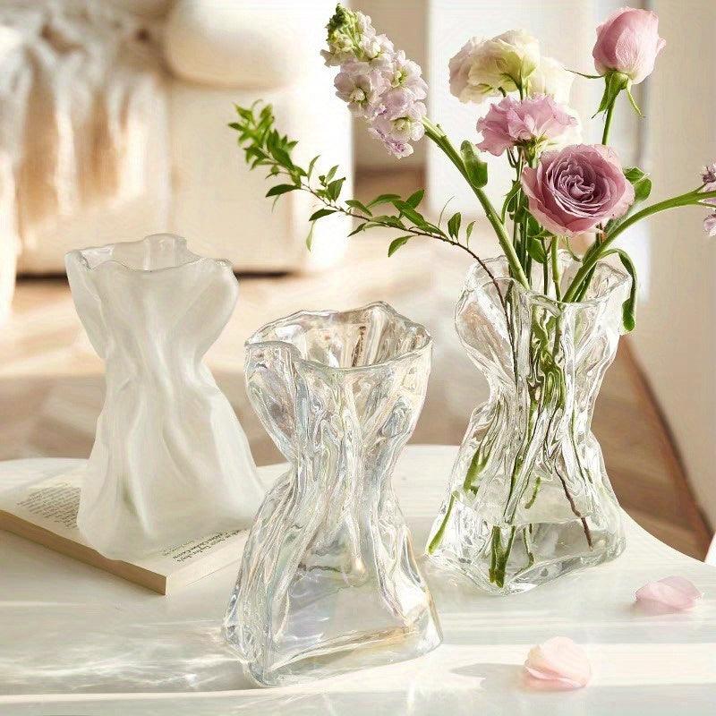Clear glass vase for floral arrangements in Nordic style decor.