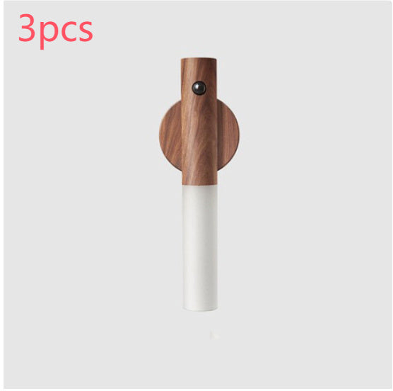 Wooden and white cylindrical product on a light gray background with &