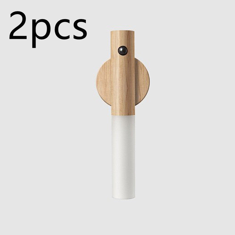 Wooden and white wall hook on a light gray background with &