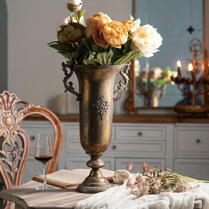 Handled metal vase for small flower arrangements and decor.