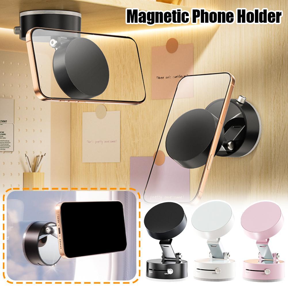 Magnetic phone holder with smartphone attachment on a wooden surface, with additional holders in different colors.