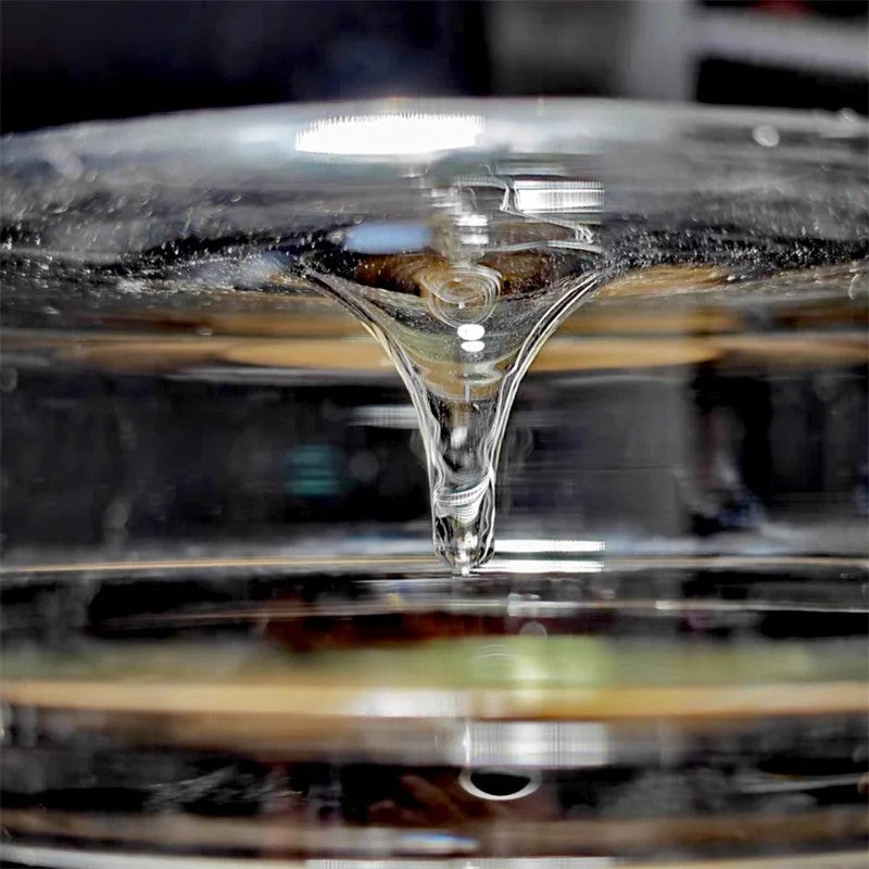 Close-up of a clear glass object with a reflective surface