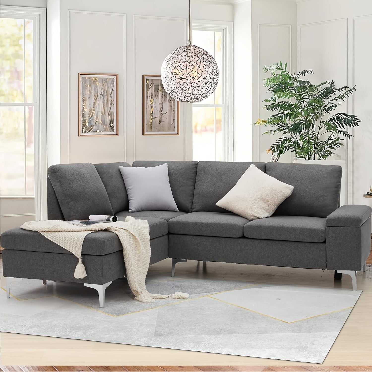 "Modern grey L-shaped corner sofa with storage compartments and ottoman."