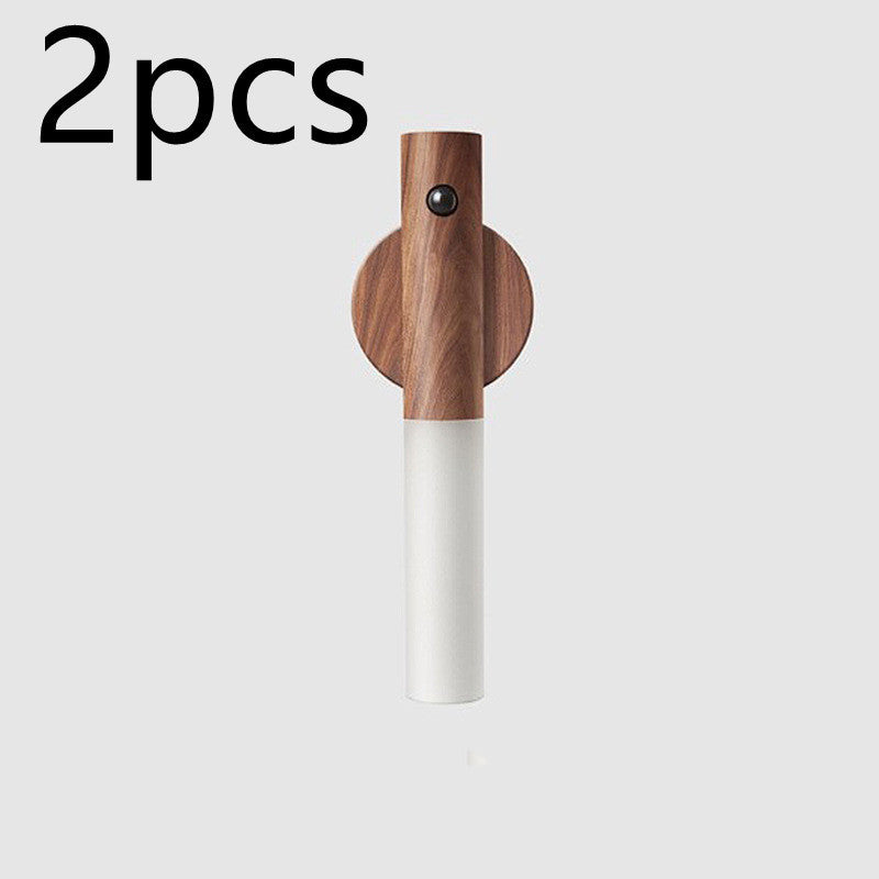 Wooden and white wall hook on a light gray background with &
