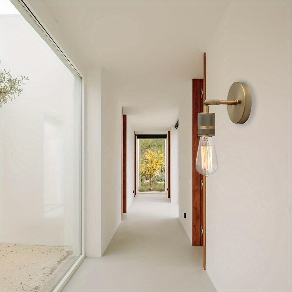 Durable metal wall sconce with hardwired installation for home decor.
