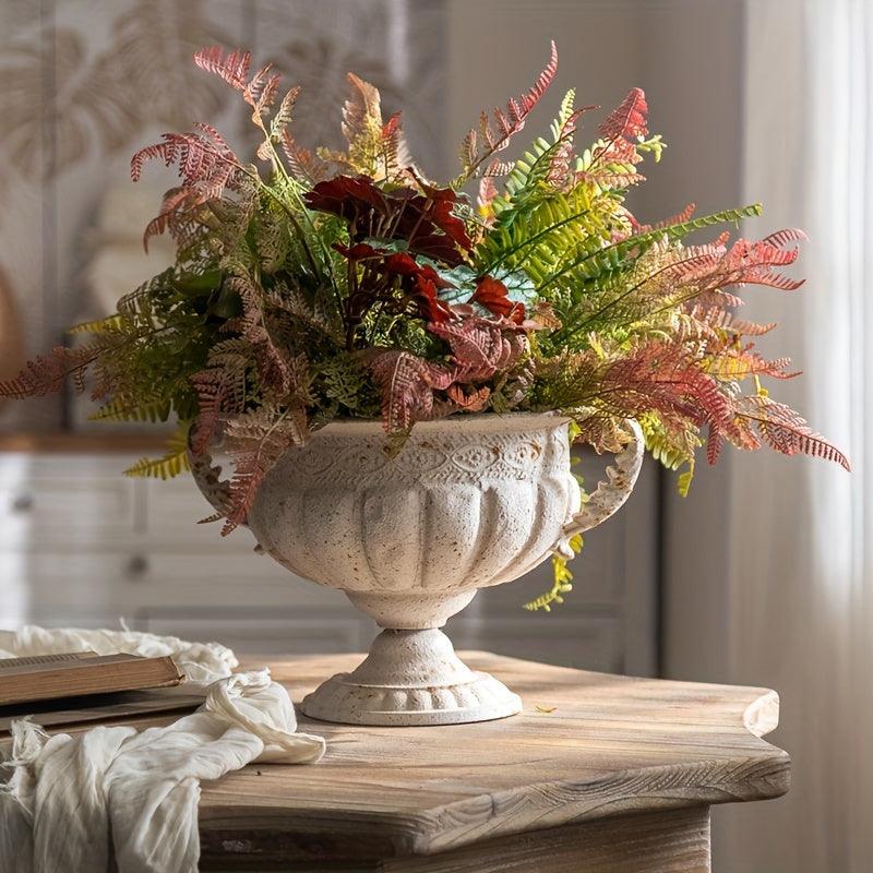 Vintage-inspired metal bud vase with romantic trophy design.