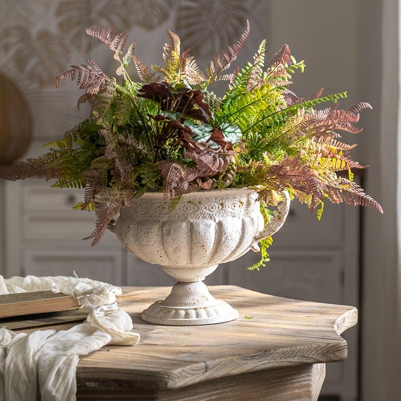 Decorative metal bud vase for vintage-themed arrangements.