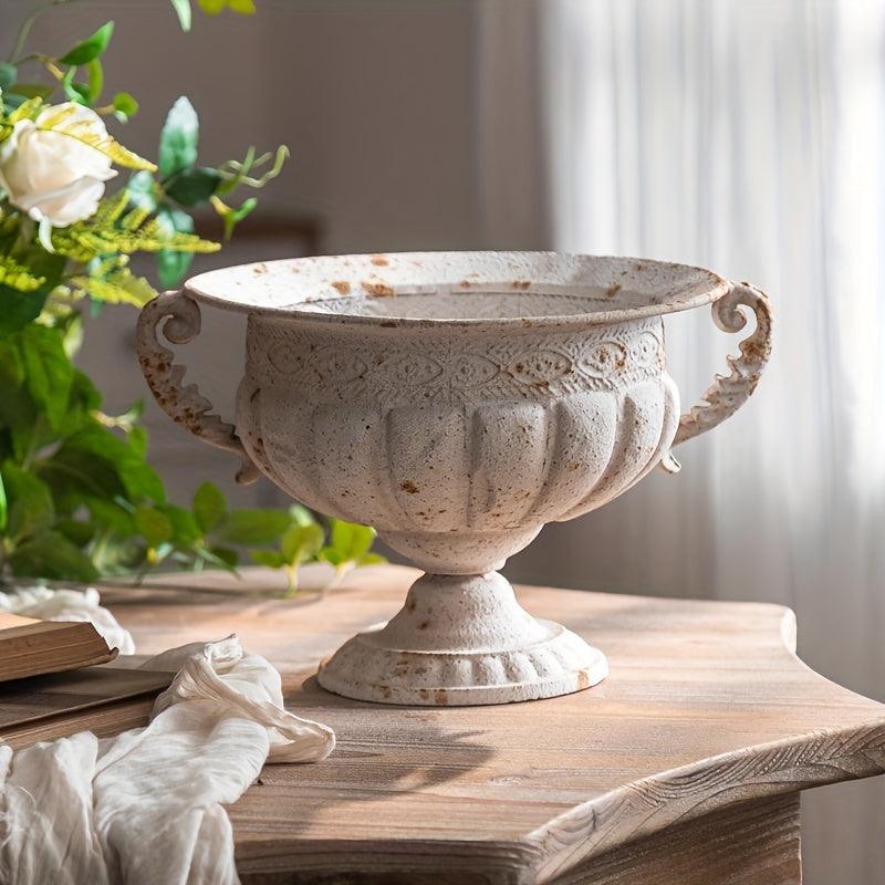 Elegant metal vase for dried flower centerpieces.