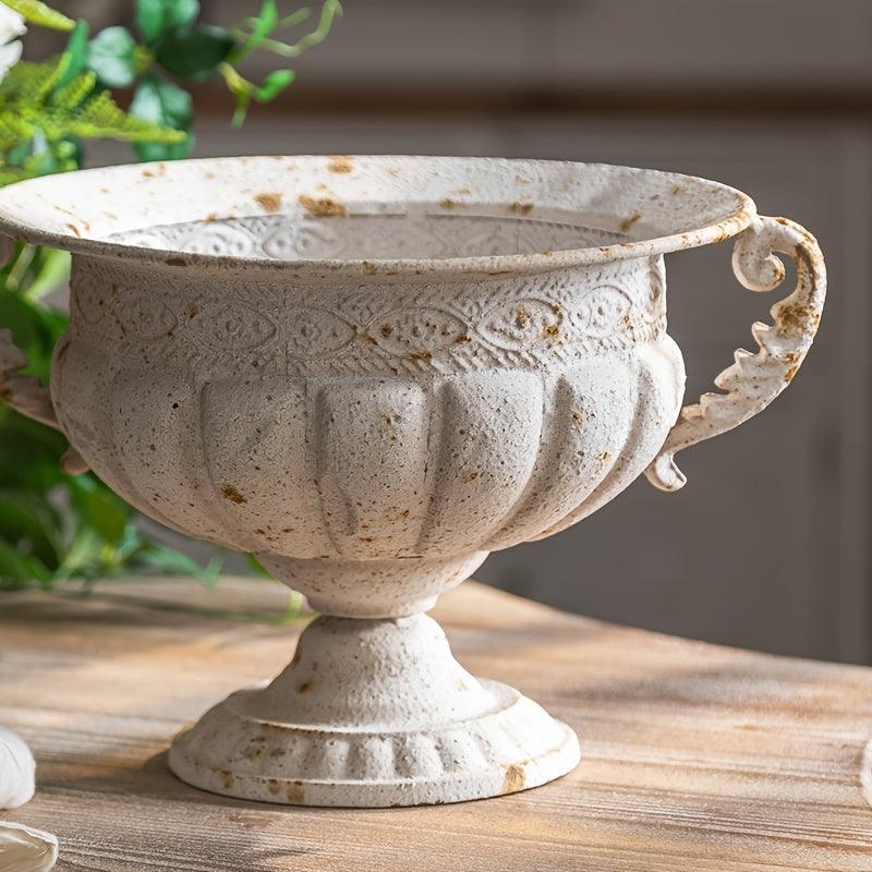 Antique-style metal trophy vase for farmhouse decor.
