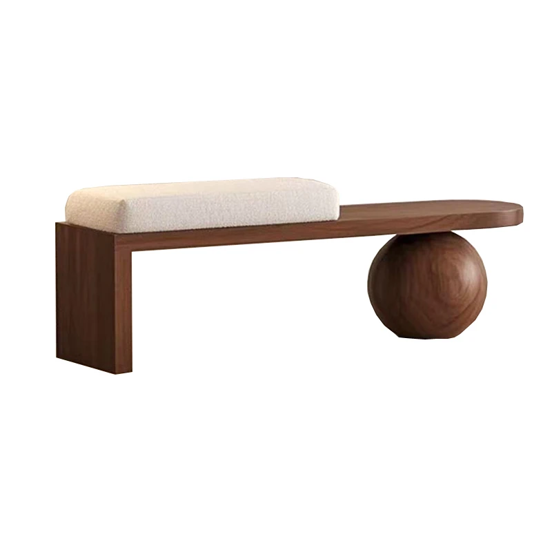 Wooden bench with a spherical base on a white background