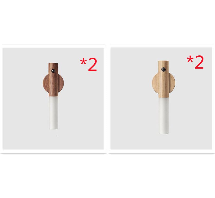 Two wooden and white cylindrical objects with a &