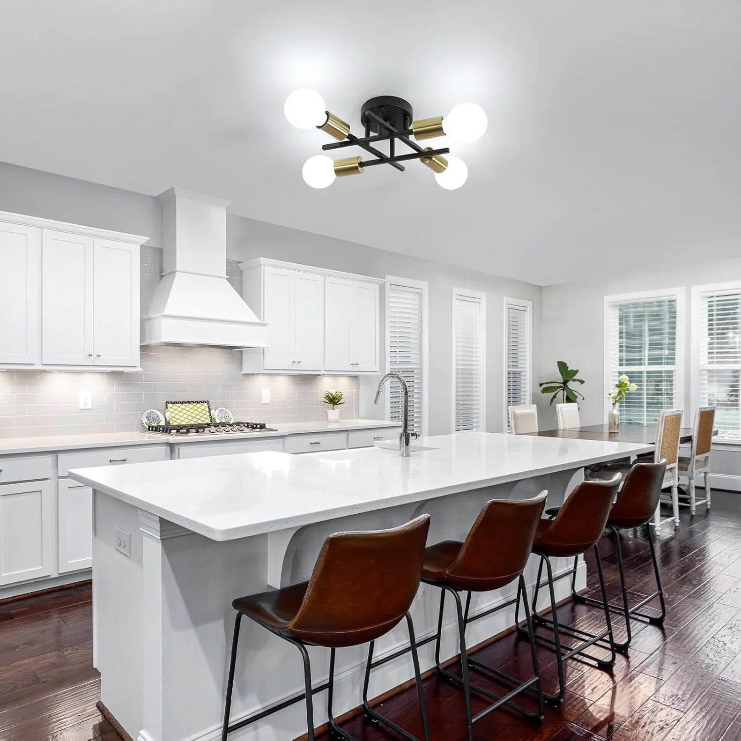 Modern kitchen with white island and brown bar stools
