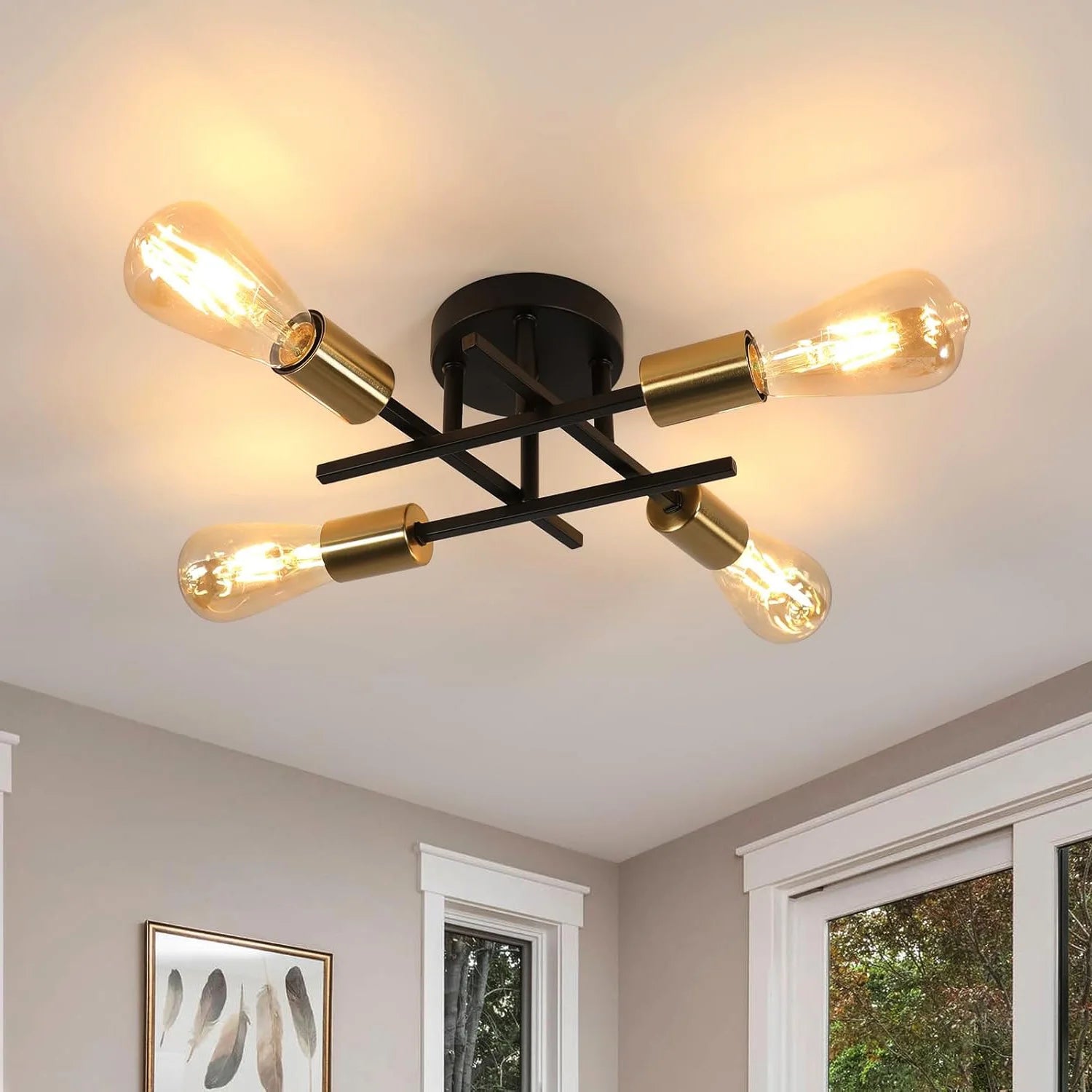 Ceiling light fixture with gold and black design on a ceiling