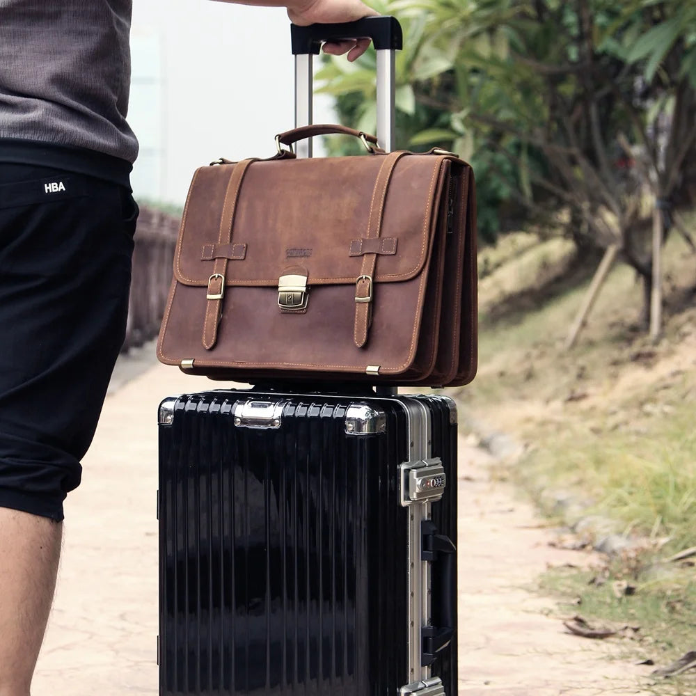 Leather briefcase on travel trolley in airport