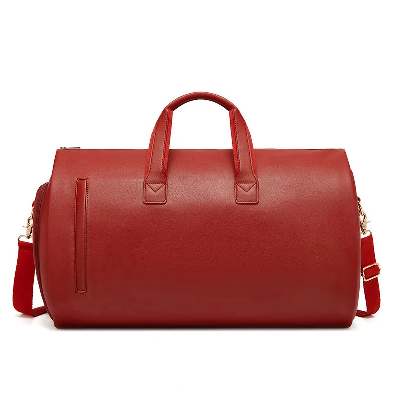 Red leather duffel bag with handles and a shoulder strap on a white background