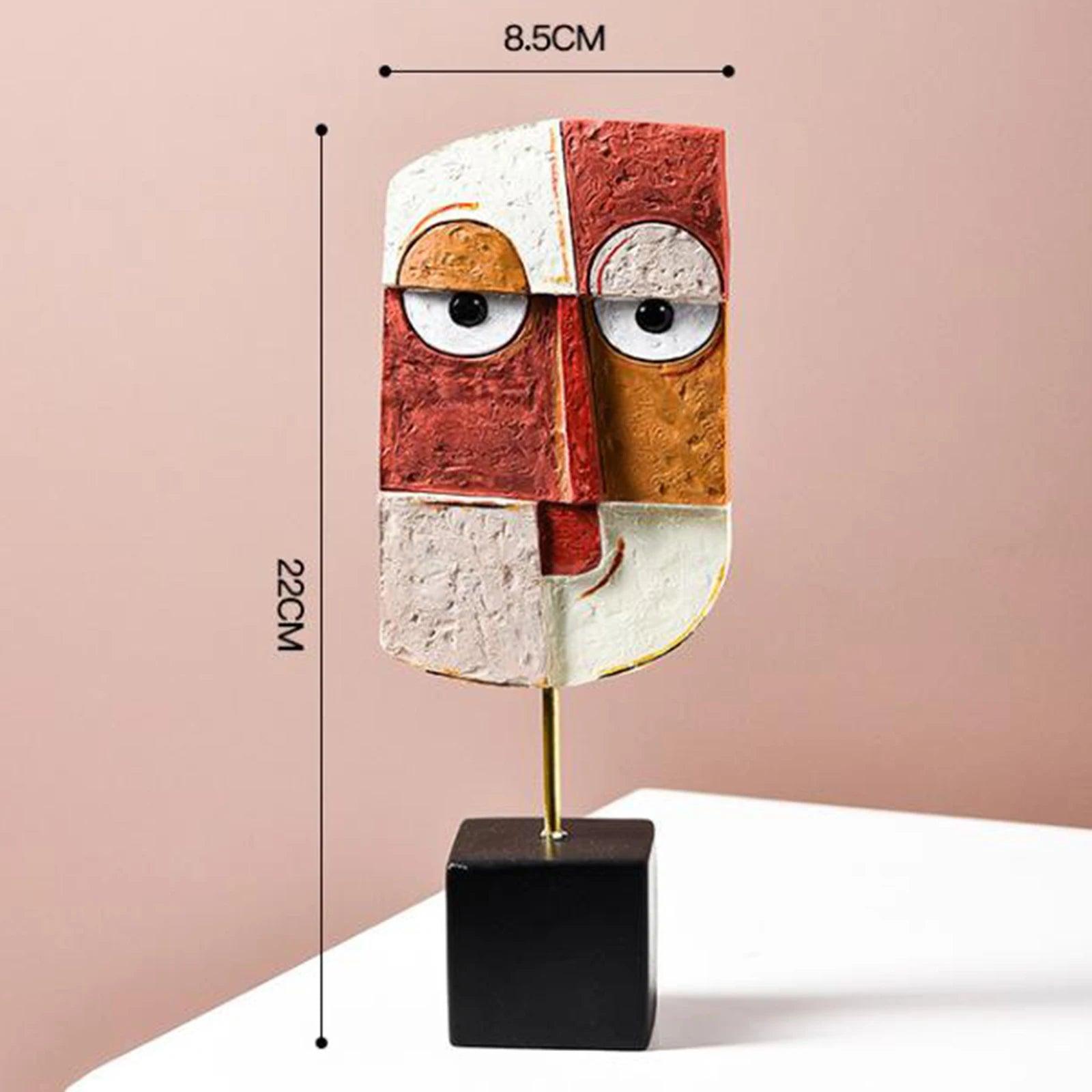 A multicolored abstract resin figurine resembling a creative face art statue, displayed on a black stand against a pink background, with measurements provided in the image.