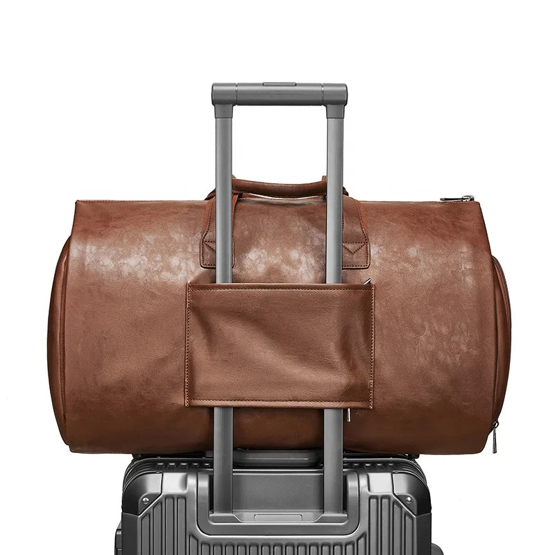 Brown leather duffel bag with wheels on a white background