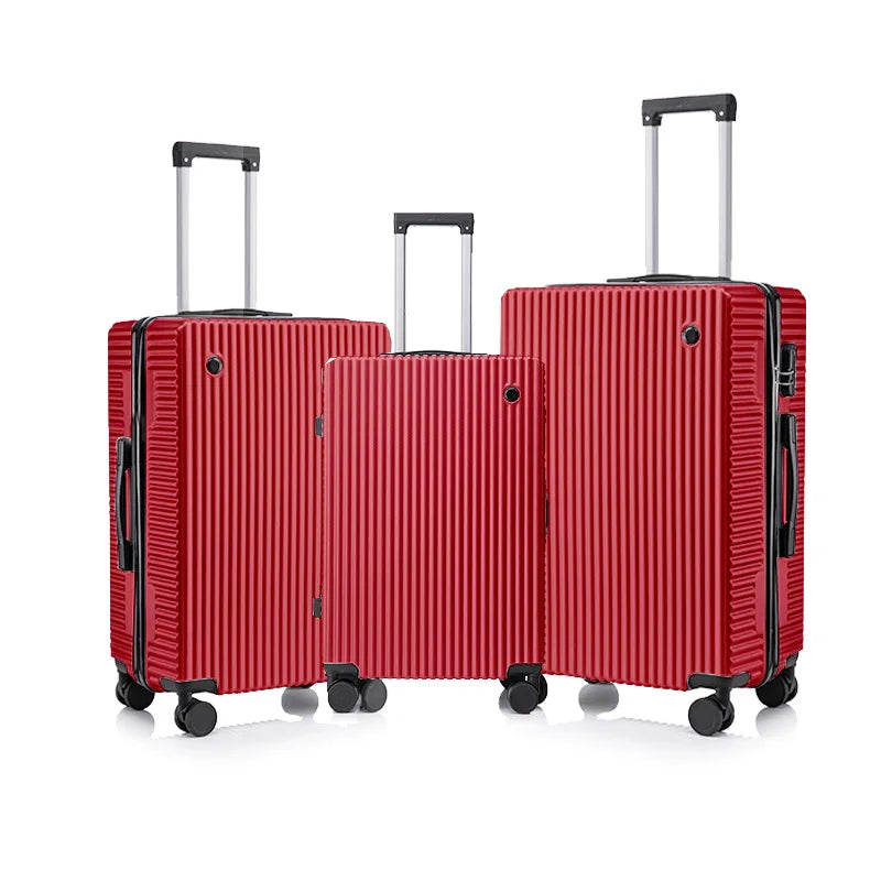 Three red suitcases of different sizes on a white background