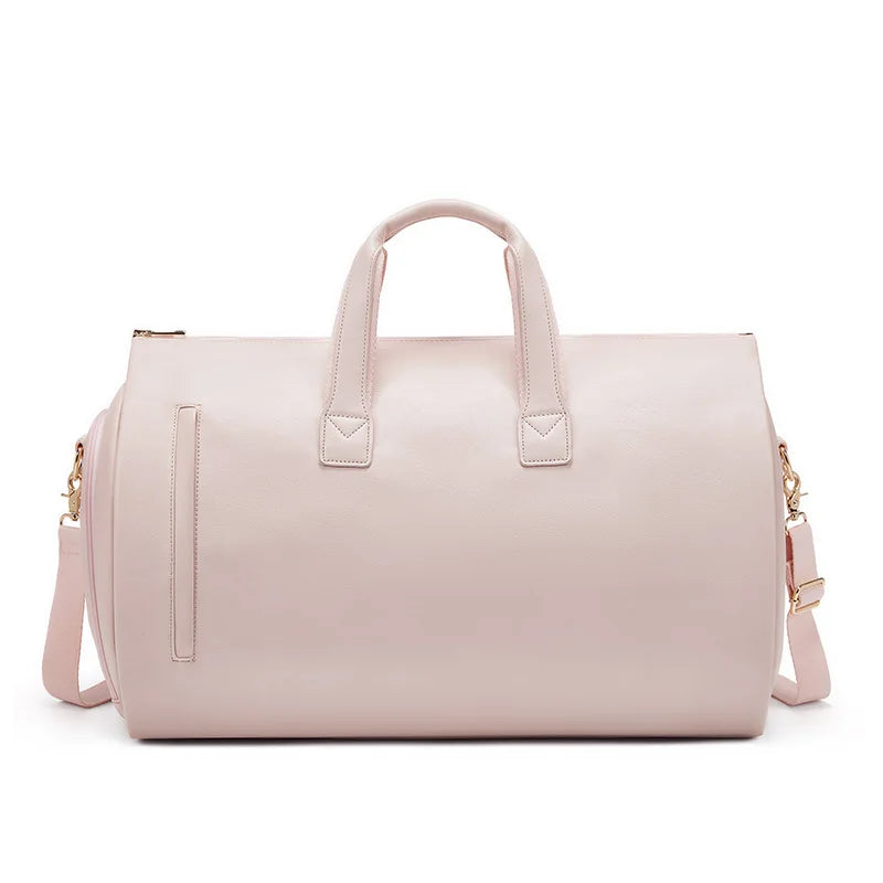 Pink duffel bag with gold accents on a white background