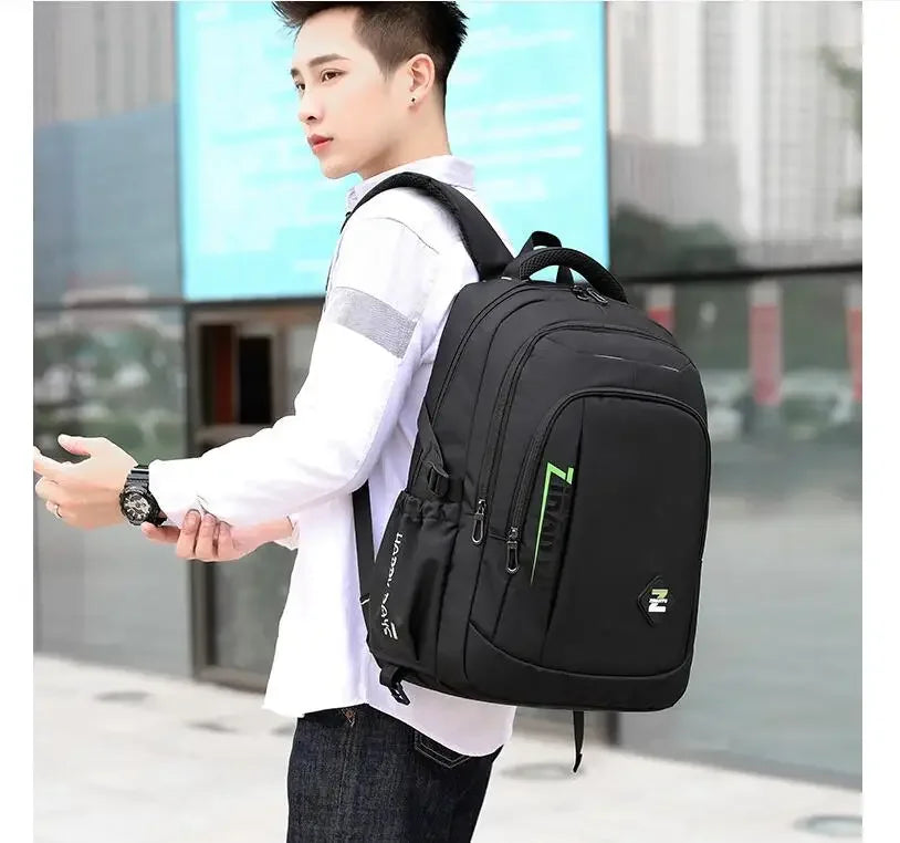 Person wearing a black backpack with a blurred background