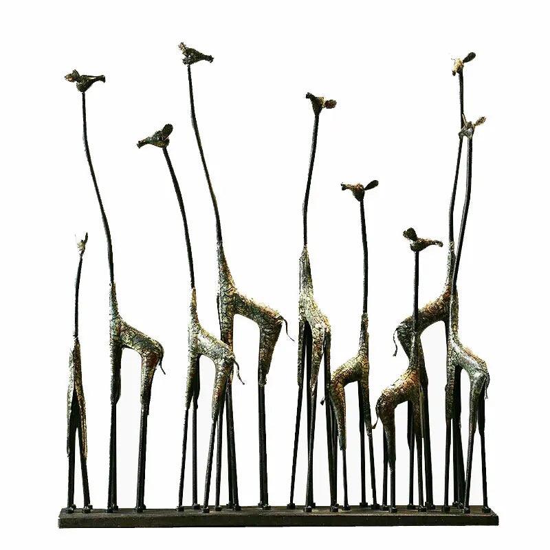 Side view of the giraffe statue on an office desk surrounded by stationery.