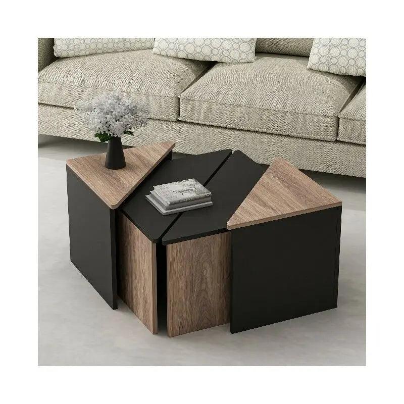 Modern black coffee table with matching side tables in living room