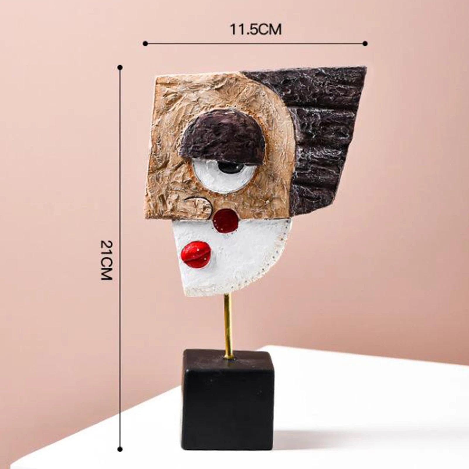 A modern and abstract resin figurine featuring geometric patterns in black, brown, and white, with a gold base.