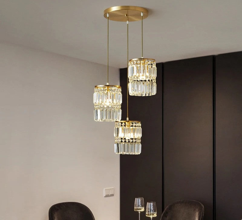 Modern chandelier with crystal accents hanging in a room.