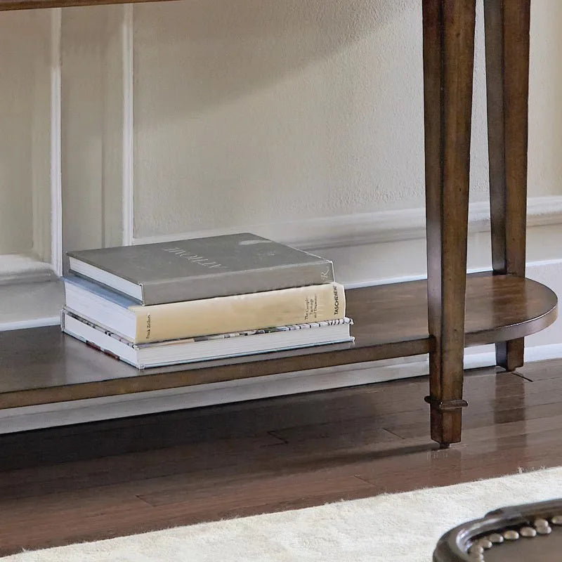 Wooden side table with books on a wooden floor