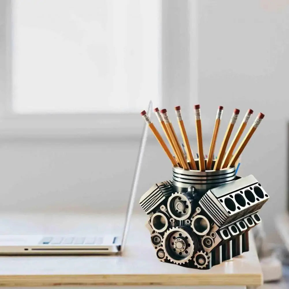 Pencil holder shaped like a car engine on a desk with pencils inside