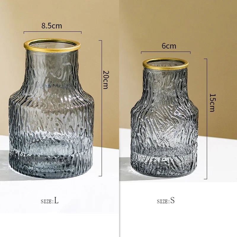 Two glass vases with gold rims, one labeled &