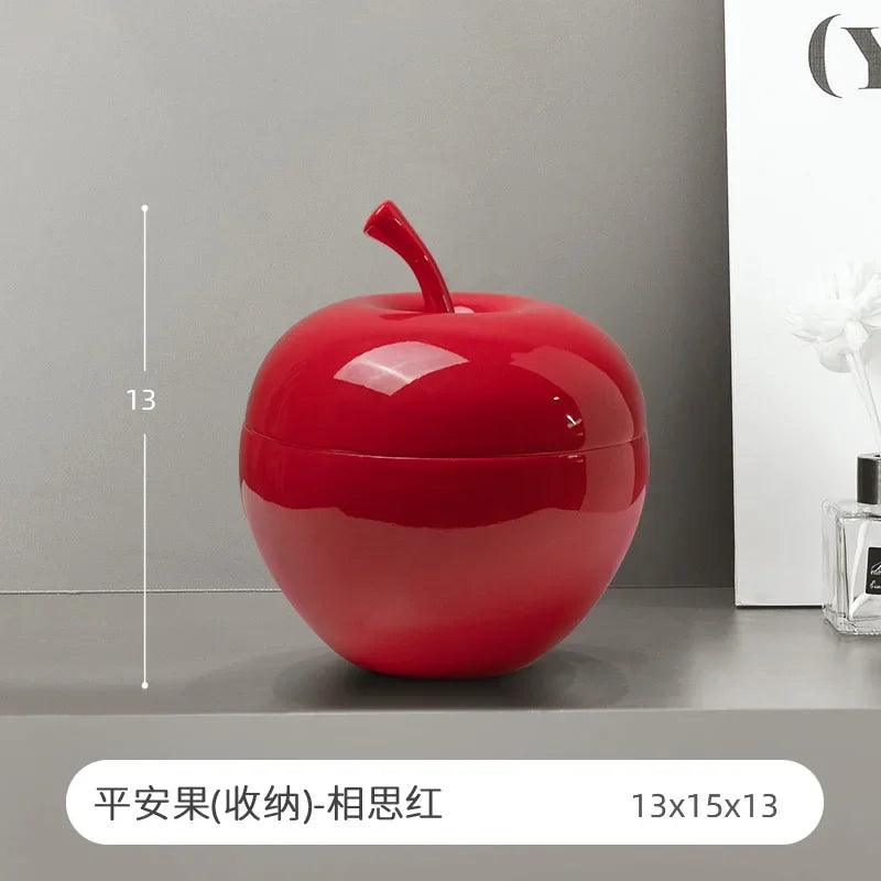 A wide-angle shot featuring all three colors of the apple decor on a shelf.