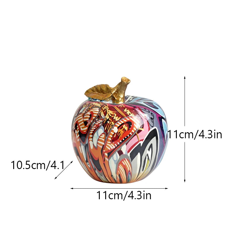 "Creative home decor using a graffiti-style apple figurine"