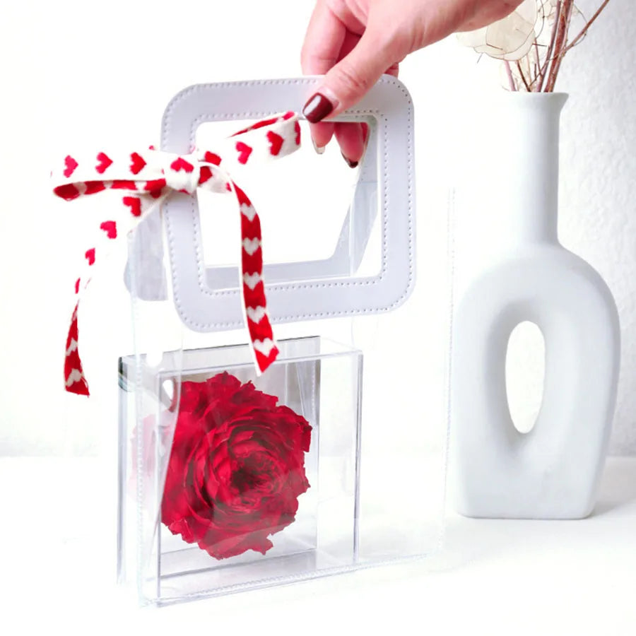 Preserved peony flower in a mirrored acrylic box.