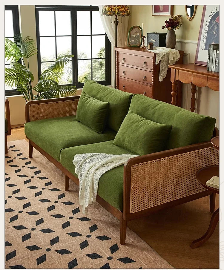 Green sofa with wicker backrest in a living room setting