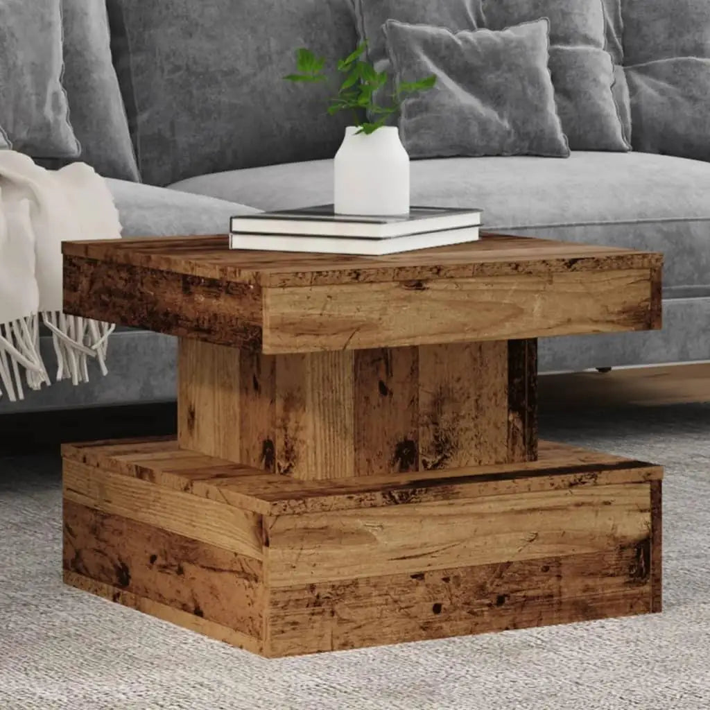 Wooden coffee table with books and a vase in a living room setting