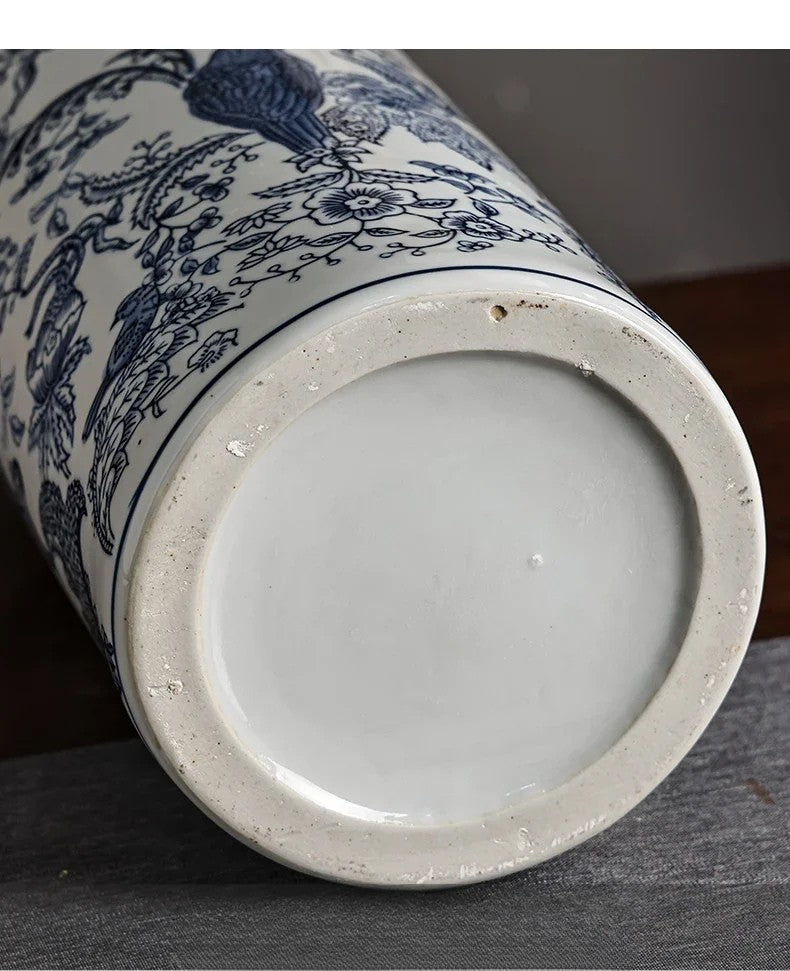 Close-up of a ceramic vase with blue floral patterns on a dark surface