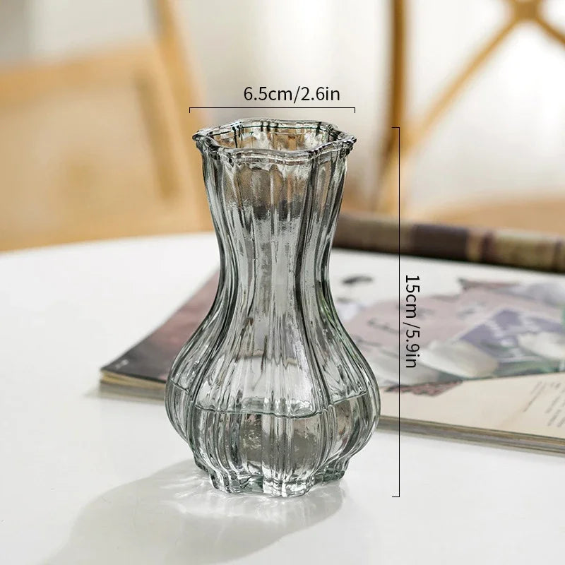 Clear glass vase with measurements on a light surface