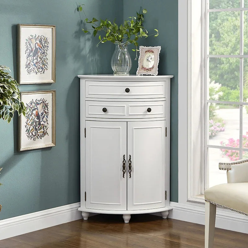 White corner cabinet with decorative items against a teal wall