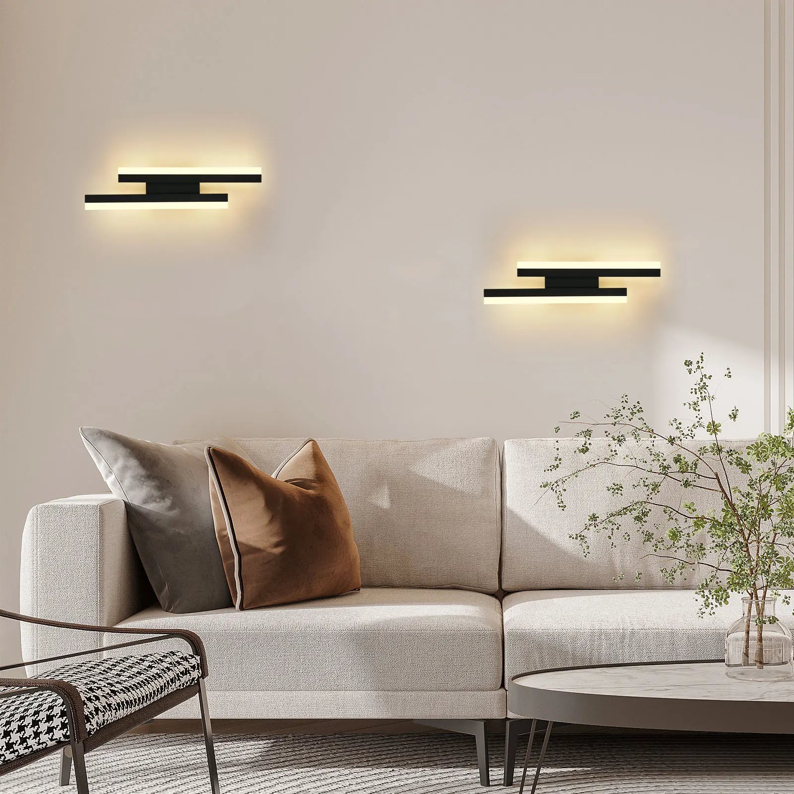 Modern living room with a beige sectional sofa, decorative pillows, and wall lights.
