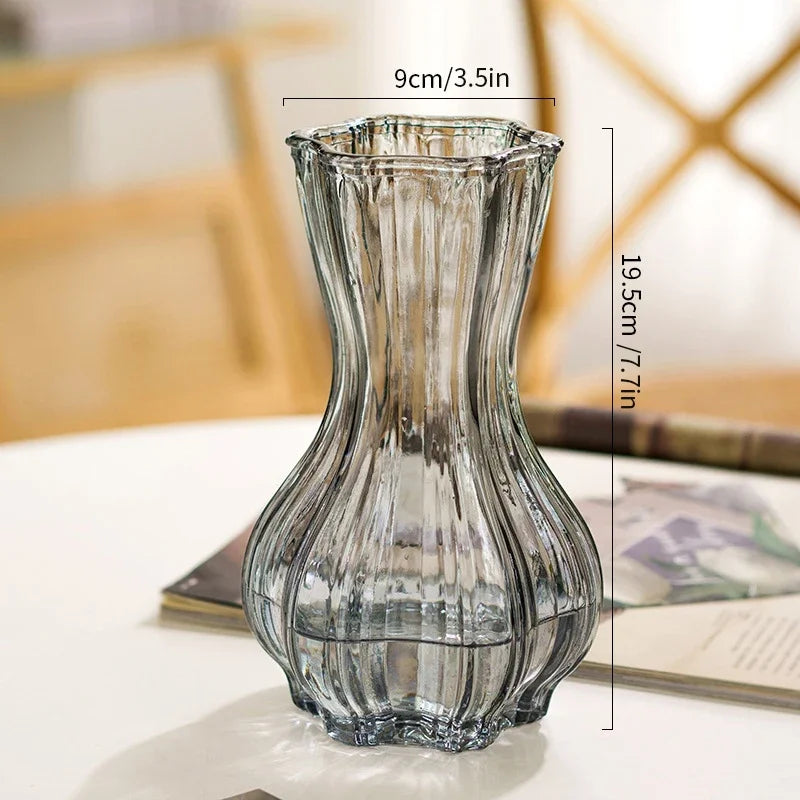 Clear glass vase with dimensions on a blurred background