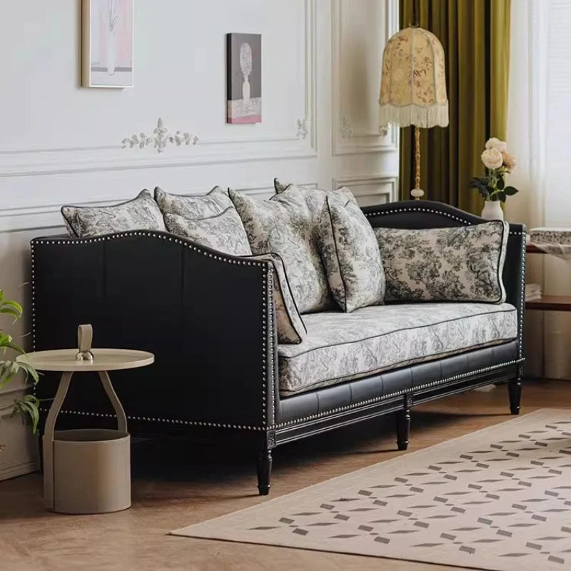 Decorative sofa with patterned cushions in a living room setting.