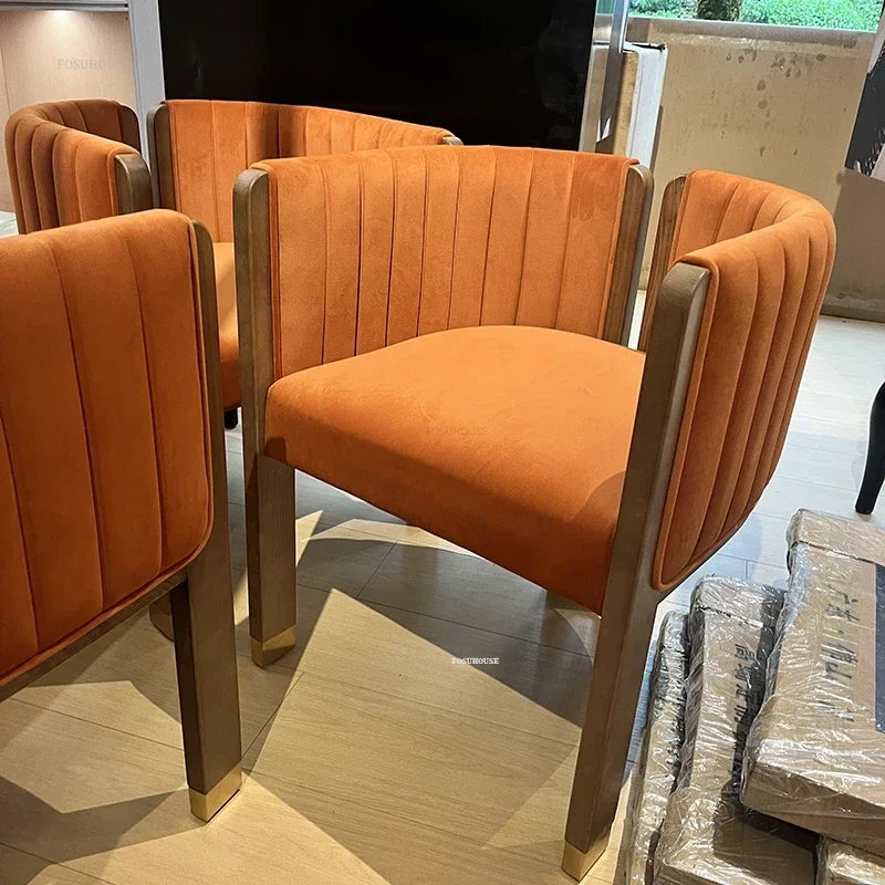 Designer dining chair featuring a sturdy solid wood frame and sophisticated fabric