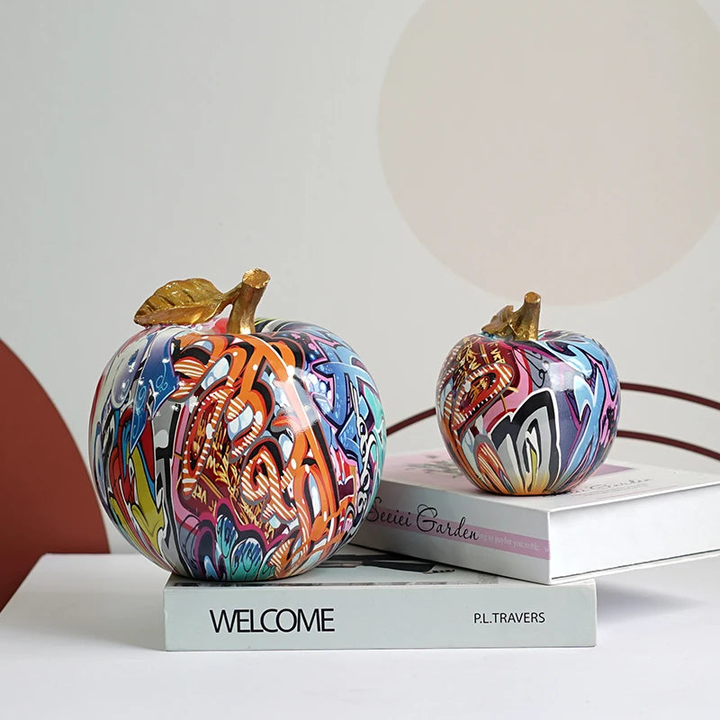"Modern painted apple ornament styled in a contemporary home"