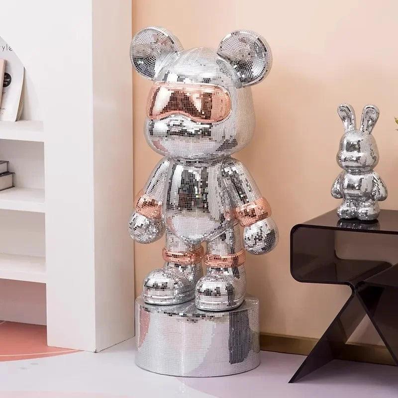 The Disco Mirror Ball Bear displayed alongside modern furniture in a brightly lit living room.